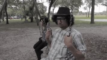 comedy swinging GIF