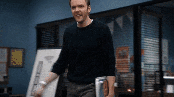 TV gif. Joel McHale as Jeff Winger in Community storms into the room and angrily looks around a table, yelling, “This is a fight! We are fighting!”
