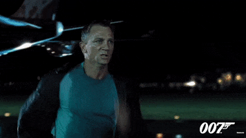 Movie gif. Daniel Craig as James Bond in Casino Royale is drenched in sweat as he runs at full speed down an airplane runway at night. An airplane lands behind him.