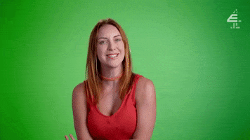 Reality TV gif. On The Sex Clinic, a red-headed woman looks at us smiling and curious, asking, "Could I be a sex addict?" which appears as text.