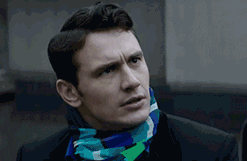 Movie gif. Actor James Franco as David in The Interview seated on an outdoor bench. He abruptly stands, scowls, and furrows his brow in shock while looking at a person offscreen up and down. 