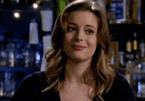 TV gif. Gillian Jacobs as Britta on Community. She furrows her brow and tilts her head slightly downwards, contemplating and skeptical. 
