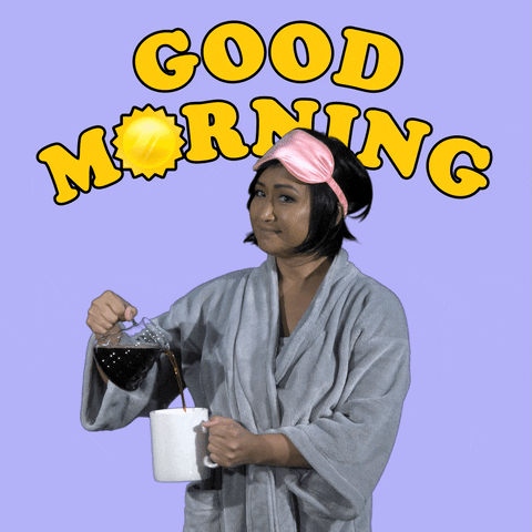 Video gif. A woman wearing a robe and a sleep mask on her forehead smiles at us while pouring a cup of coffee. Her cup of coffee overflows and the text above her reads, "Good Morning."