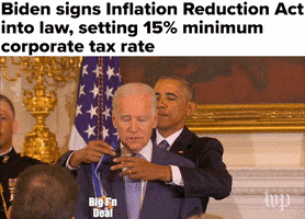 Video gif. President Obama puts a Medal of Freedom labeled “Big F’n Deal” around Vice President Biden’s neck. Caption, “Biden signs Inflation Reduction Act into law, setting 15% minimum corporate tax rate.”