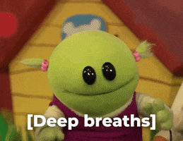 TV gif. Mona from Nanalan takes a deep breath and sighs, opening her mouth wide. Text, "[deep breaths]."