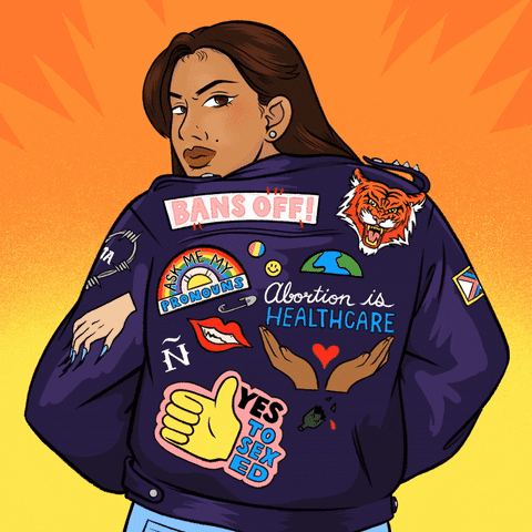 Text gif. Latina woman wearing a bomber jacket with many patches, "bans off," "abortion is healthcare," "ask me my pronouns," "yes to sex ed," alongside a tiger, smiley face, pair of hands holding a heart, pride flag, the Earth, cat scratch, and pansexual pride pin against a pulsing orange background.