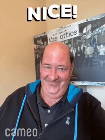 Celebrity gif. Brian Baumgartner, best known as Kevin Malone from The Office, does a Cameo, grinning and nodding as he speaks to us. Text, "Nice!"