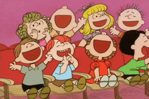TV gif. A crowd of Peanuts characters applause and cheers in You're Not Elected, Charlie Brown.