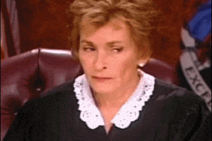 TV gif. Judge Judy closes her eyes and sighs, face palming into her hand as if she has just heard the dumbest thing ever.