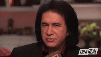 TV gif. In a clip from Gene Simmons Family Jewels, Gene raises one eyebrow and smirks as he says to us: Text, "Me."