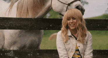 surprised miley cyrus GIF