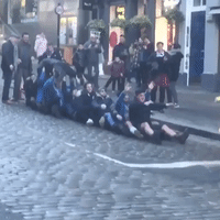 Rugby Fans Crowd Surf on Edinburgh's Royal Mile