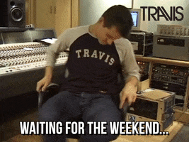 Video gif. A man spins around in an office chair in a recording studio. He keeps his head down like he’s bored and tired. Text, “Waiting for the weekend.”