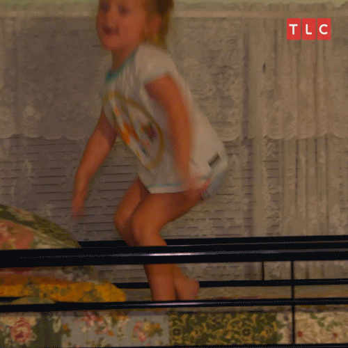 Video gif. A young girl dances on a top bunk as she sings,"It's my birthday! It's my birthday! It's my birthday!" She stops, then topples over on the bed.