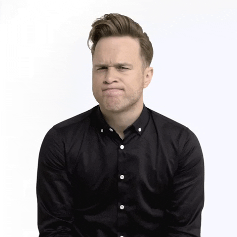 Celebrity gif. Olly Murs shrugs and tips his head up to one side like he's thinking about something.