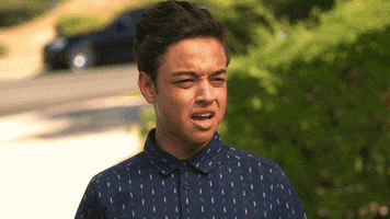 TV gif. Brett Gray as Jamal Turner in On My Block has his mouth wide open as he gasps in shock. Jason Genao as Ruby Martinez grimaces in disgust.