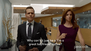 TV gif. Gabriel Macht and Sarah Rafferty as Harvey and Donna in the show Suits walking through an office. Text, "Why can't it just be a 'I'm a great boyfriend' coffee?"
