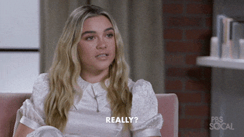Celebrity gif. Florence Pugh sits in an interview and looks over at the interviewer very seriously, saying, “Really?”