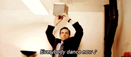 Steve Carrell portraying Michael Scott from The Office singing "Everybody Dance Now" while holding a speaker