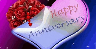 Text gif. White heart decorated with a bouquet of red roses and animated hearts that pour from the bouquet. A single rose escapes and floats across the heart. Text, "Happy Anniversary"