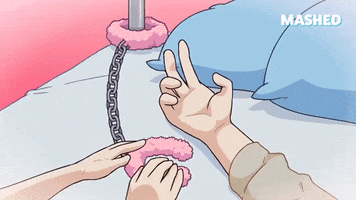 Cartoon gif. Anime cartoon of a person’s wrist being chained to a bed post with pink fuzzy handcuffs