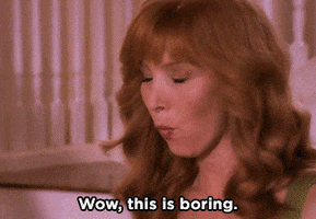 TV gif. Lisa Kudrow as Valerie on the Comeback leans over and gives someone a quick annoyed glance and then gives a wide fake smile, laughing at her own boredom, as she says, “Wow, this is boring.”
