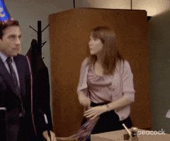 Character in "The Office" dancing.