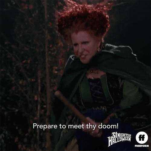 Movie gif. Bette Midler as Winifred in Hocus Pocus rides a broom as she reaches forward menacingly. Text, "Prepare to meet thy doom!"