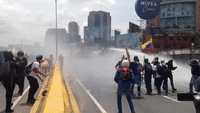 Caracas Protesters Face Off Against Water Cannons