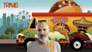 Celebrity gif. Travis singer Fran Healy stands in front of a colorful cartoon taco truck that has a giant taco topper. He stares hungrily at a taco descending from the sky and turns back to look at the truck. In a festive front, text reads, "Taco Tuesday."