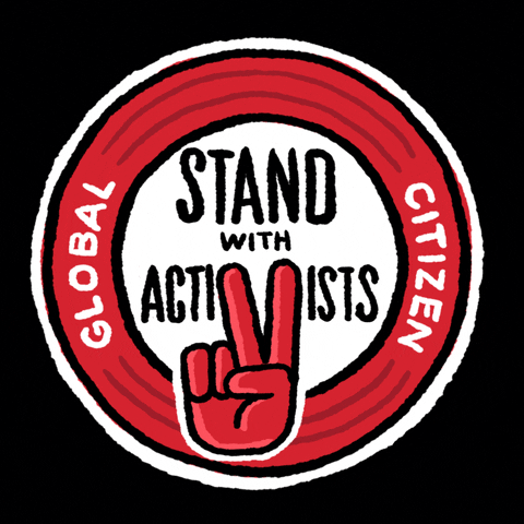 Digital art gif. Circular red and white sticker against a black background features a hand giving a peace sign. Text, “Global Citizen: Stand with Activists.”
