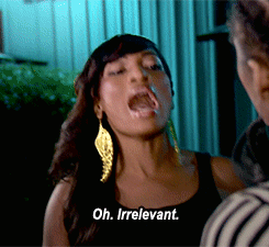 Reality TV gif. Joseline Hernandez from Love and Hip Hop: Atlanta. She's annoyed as she talks to a man and she uses both hands to shut up him, waving at him and saying, "Oh. Irrelevant."
