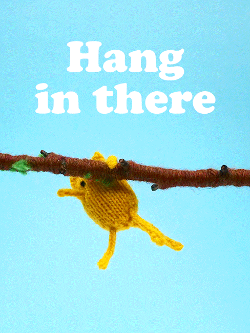 Cartoon gif. We see stop-motion animation of a yellow cat made of yarn, struggling to cling to a yarn branch in a nod to the classic poster. Text: "Hang in there."