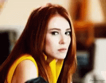 Gif of a white, red-headed woman sticking her tongue out and making a face