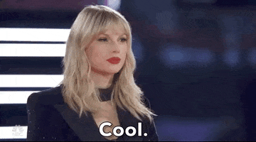 Reality TV gif. Musician Taylor Swift gently nods and says "cool" with a subtle smile on The Voice. 