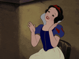 Movie gif. Snow White smiles gleefully as she happily claps her hands.