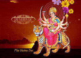 Digital art gif. Against a sunset photo background, we see a still illustration of the goddess Parvati on a tiger as flowers fall over them. Text, "Jai mata di" and "Maa Vaishno Devi".