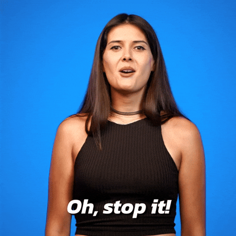 Video gif. A woman playfully shakes her head and says, “Oh stop it!”