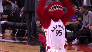 Sports gif. Toronto Raptors mascot violently waves his arms in the air as he tries to hype up the crowd.