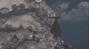 dragon takes out part of red keep GIF by Vulture.com