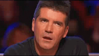 TV gif. Simon Cowell as judge on American Idol stars in open-mouthed boredom with a glazed expression on his face. 