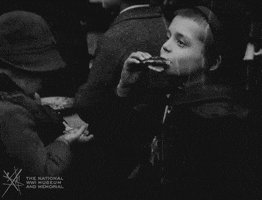 NationalWWIMuseum black and white military footage snacking GIF