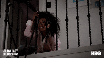 TV gif. Gabrielle Dennis from A Black Lady Sketch Show is sitting on the top floor of a home and clutching the bottom of the stair railing while yelling in fear, "Get out while you still can!"