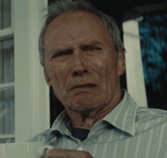 Movie gif. An older Clint Eastwood looks right of frame with disapproval. He lowers a white mug as he slowly turns away to the left.