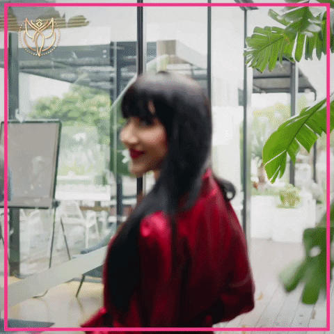 Video gif. Businesswoman Ingrid Arna walking and looking behind her, beckoning with her finger. Text, "let's get it on!"