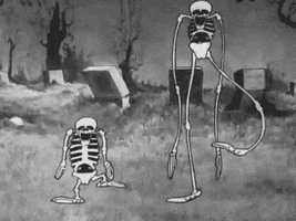 Cartoon gif. A very short skeleton and a very tall skeleton stomp their feet and wiggle their arms in the middle of a graveyard. The tall one’s arms and legs look like noodles. 