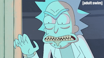 Cartoon gif. Closeup of Rick in Rick and Morty as he bares his teeth menacingly and grabs with his clawed hands in a shadowy room.