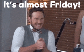 TV gif. Chris Pratt as Andy Dwyer on Parks and Recreation has a bowtie and nice vest on. He rubs his hands together with wide eyes and a wide grin that looks like he’s scheming something up. Text, “It’s almost Friday!”