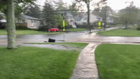 Trash Can Floats Down Street in New Jersey Flash Flood