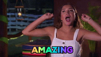 Reality TV gif. Nicole from Bachelor in Paradise in an interview holds her arms up while flicking her fingers out like popcorn popping as she says, "Amazing."